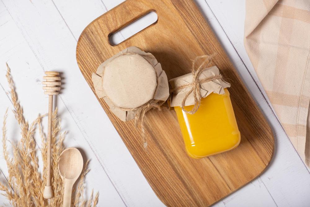 jars-with-honey-nuts-honey-wooden-background-top-view-flat-lay